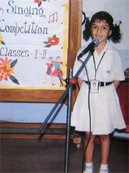 Varima Sharma (I-C) exhibits her singing talent