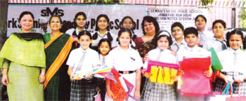 Earth Day - Young students proudly holding their self made paper bags - Click to Enlarge